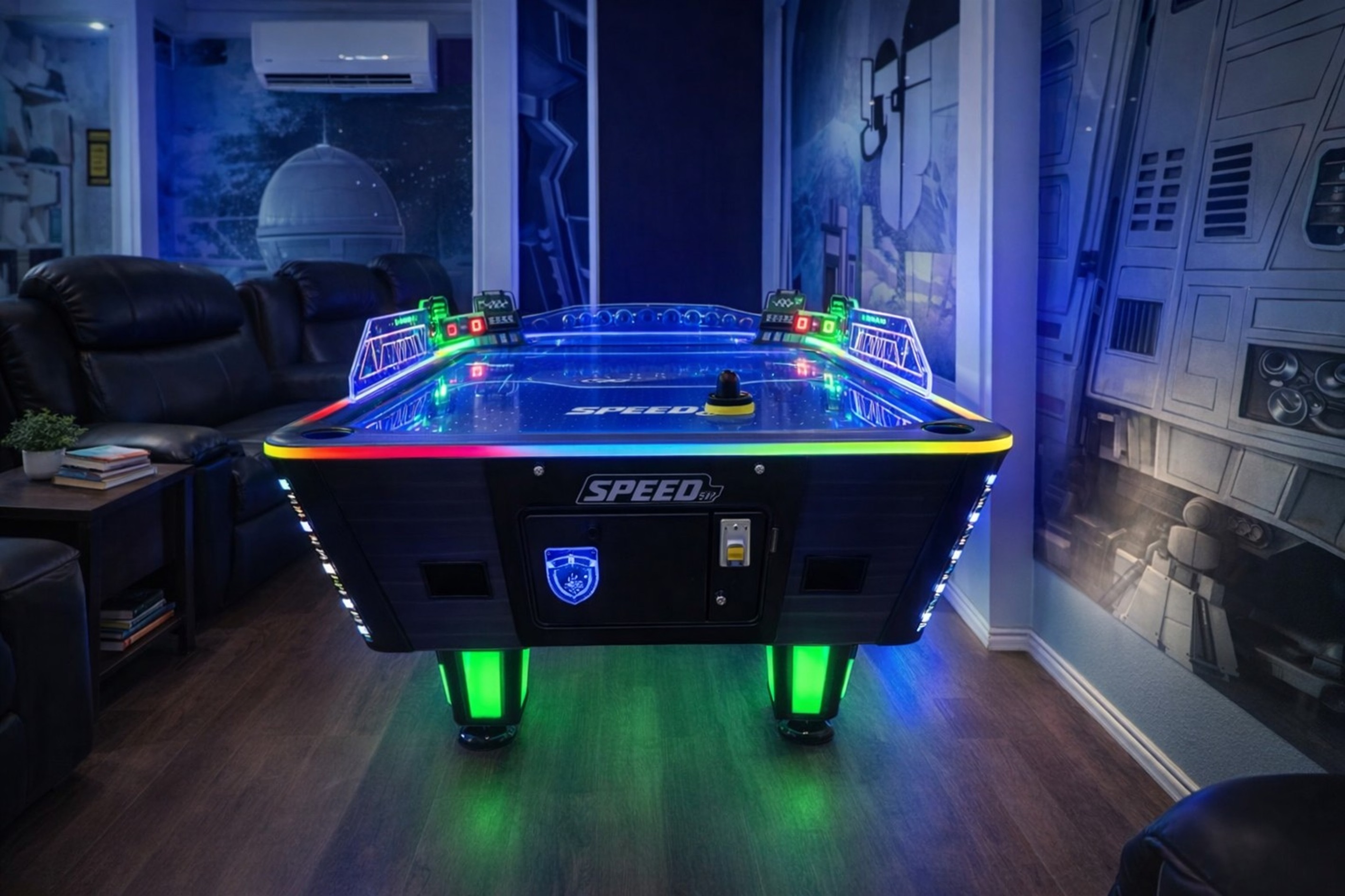 Modern air hockey table illuminated with colorful LED lights in a themed game room.