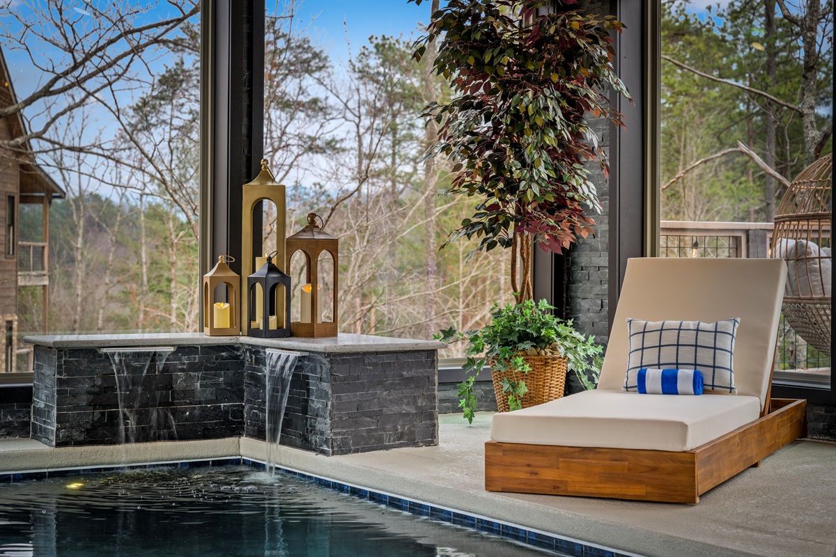 Relax in the lounge chair beside the heated indoor pool while enjoying the peaceful sound of cascading water and Smoky Mountain views.