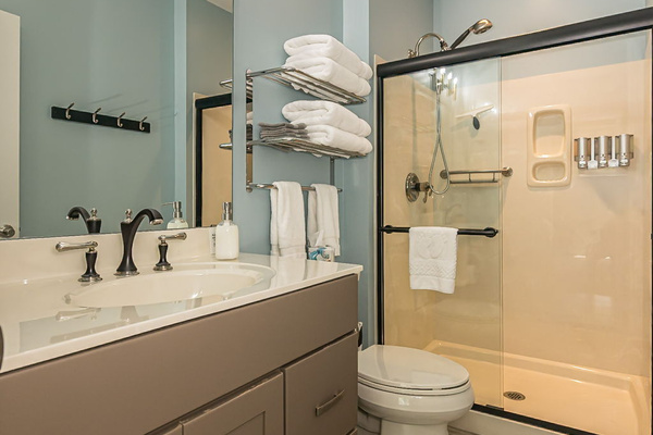 Bathroom 3 is attached to bedroom 3 and has a walk-in shower.