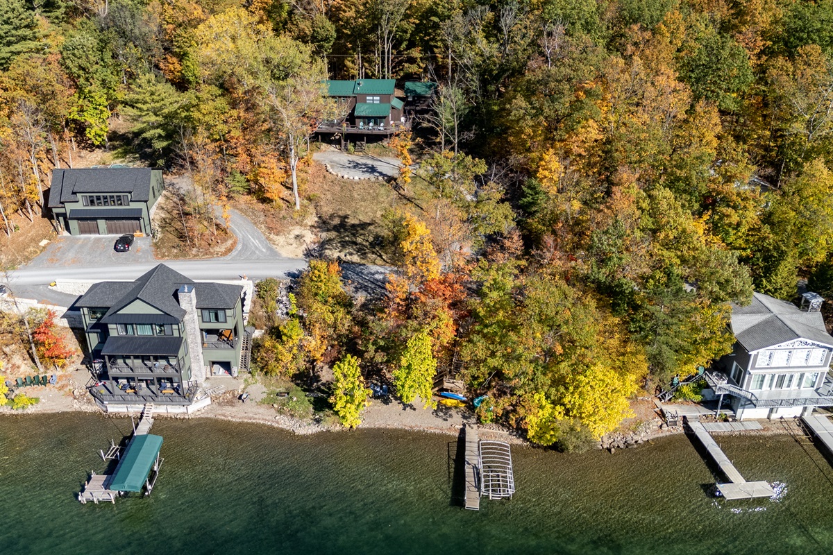 Aerial view of the cabin tucked into the trees above Keuka Lake — your hillside escape.