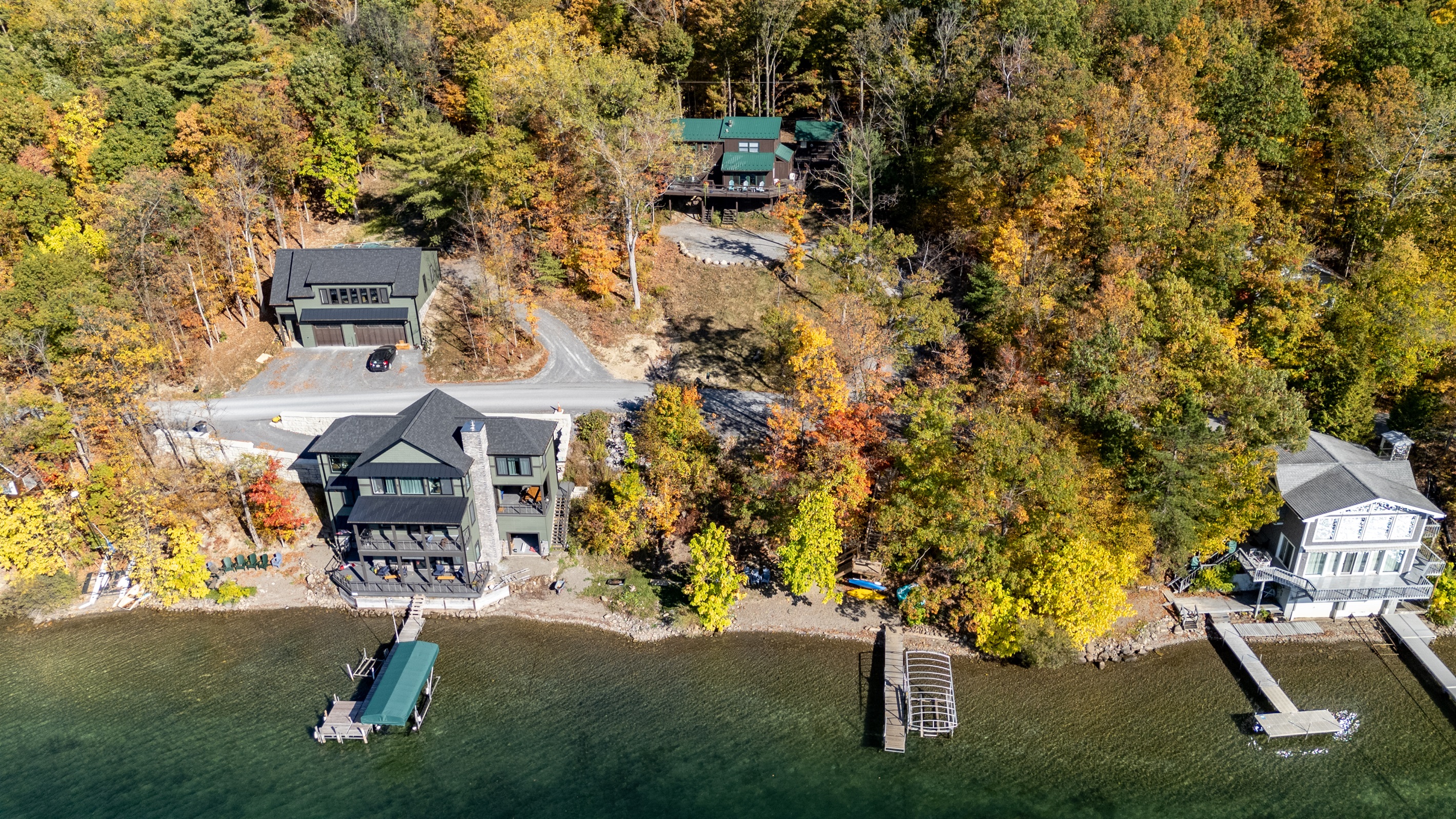 Aerial view of the cabin tucked into the trees above Keuka Lake — your hillside escape.