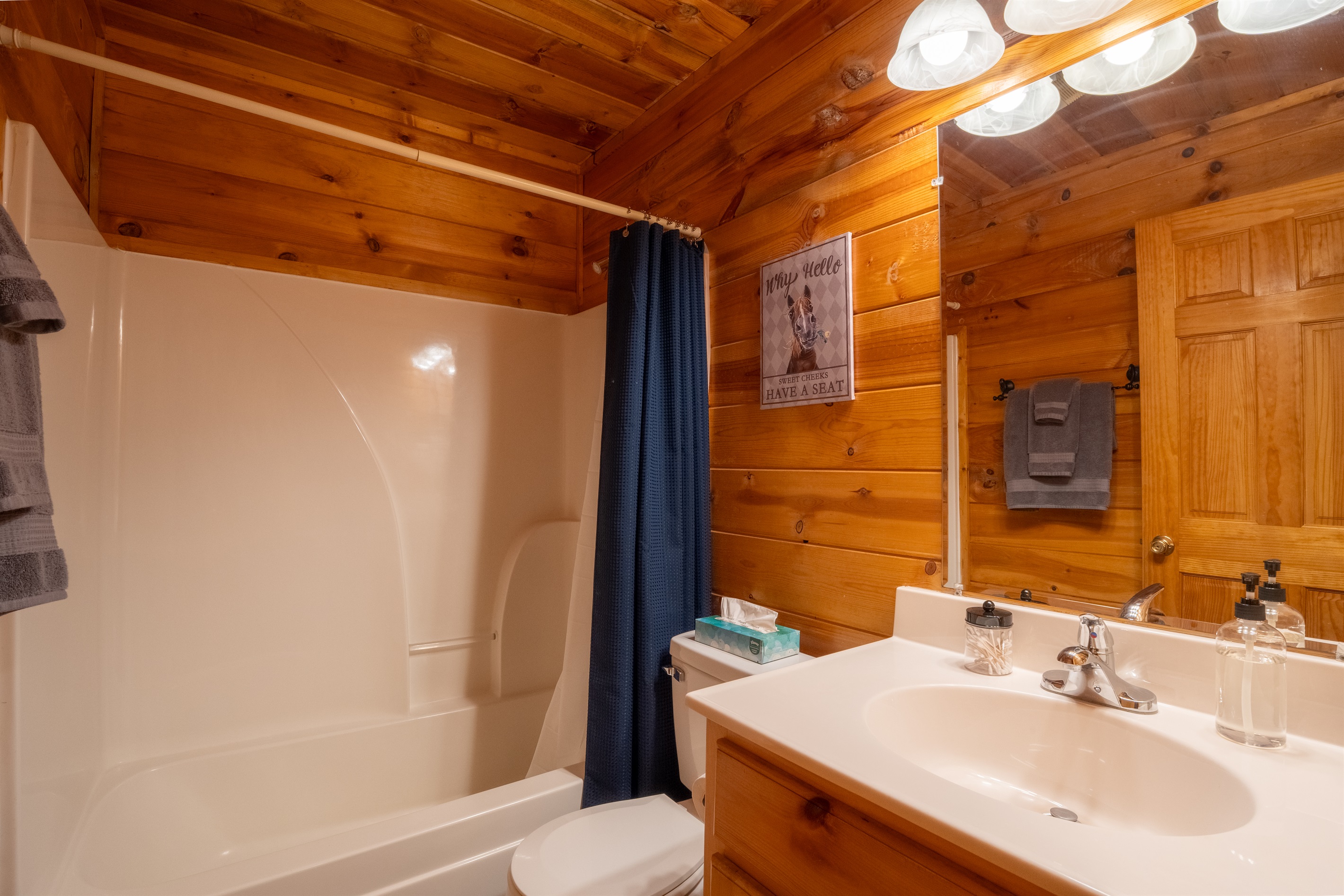 The ensuite bathroom has a tub-shower combo.