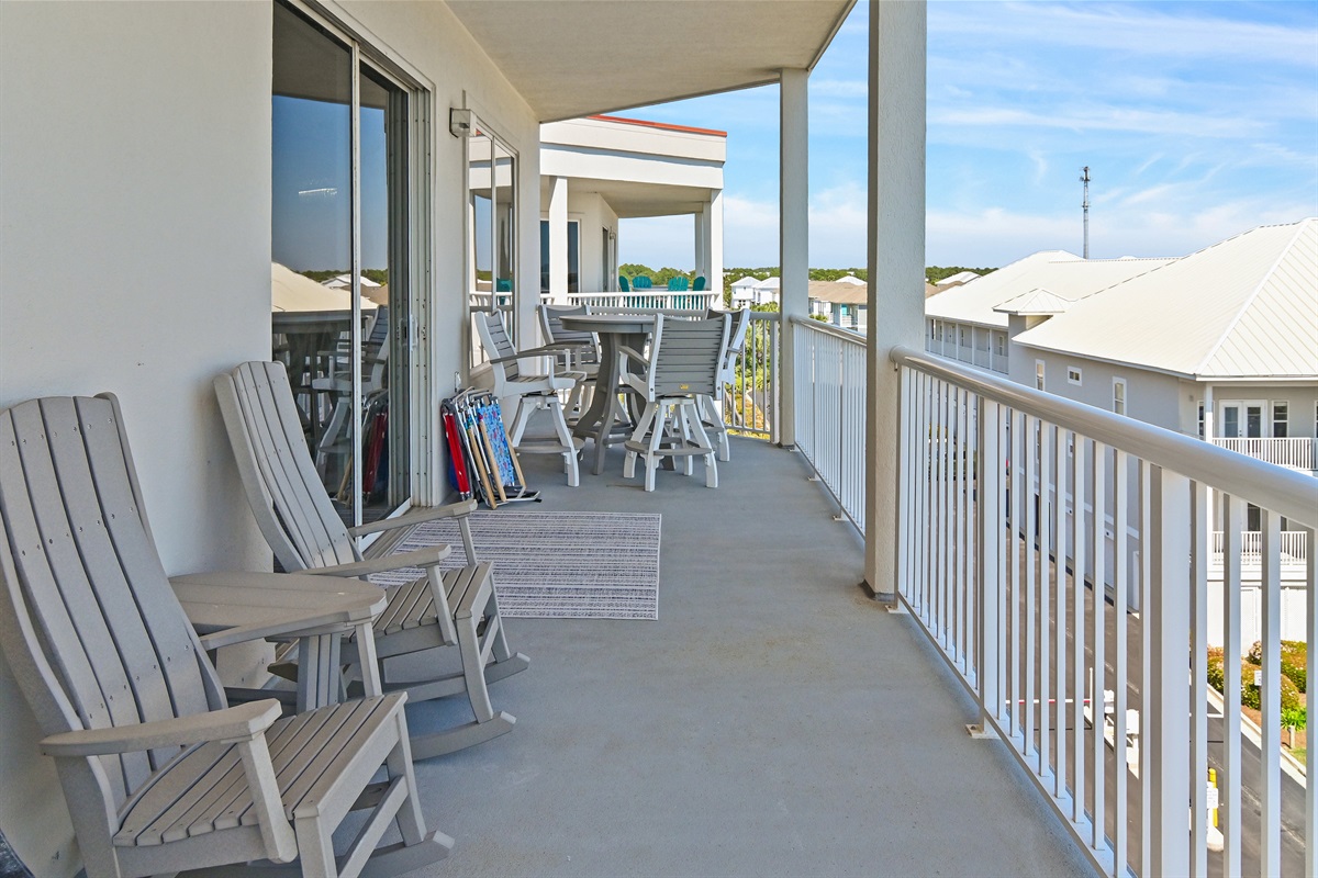 Balcony seating overlooking the sugar‑white sand