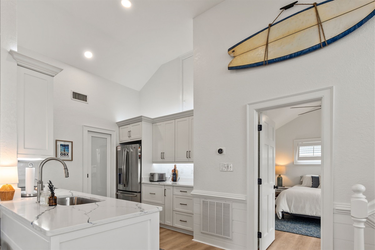 Clean, bright kitchen with modern finishes and everything within reach.