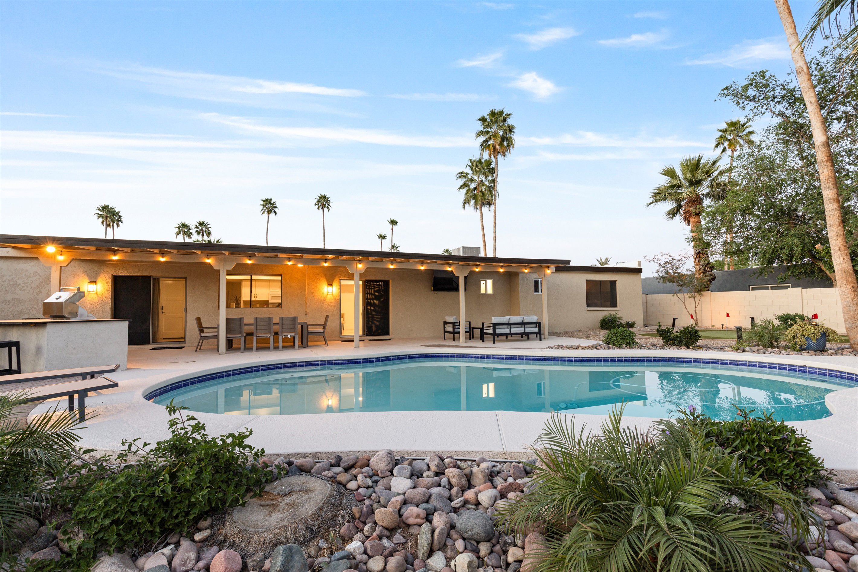 Heated pool with plenty of lounge space for relaxing in the sun