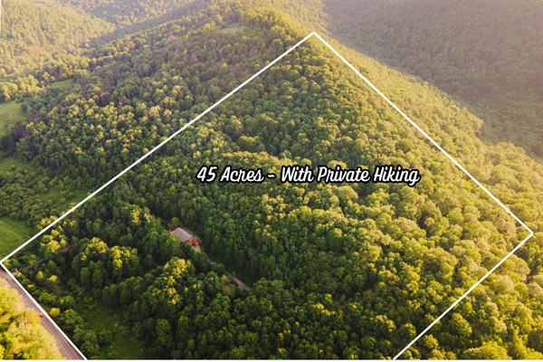 Nestled on 45 private acres, Cosmic Ridge Retreat offers your own secluded mountain escape — complete with private hiking trails, wooded ridgelines, and total peace and quiet.