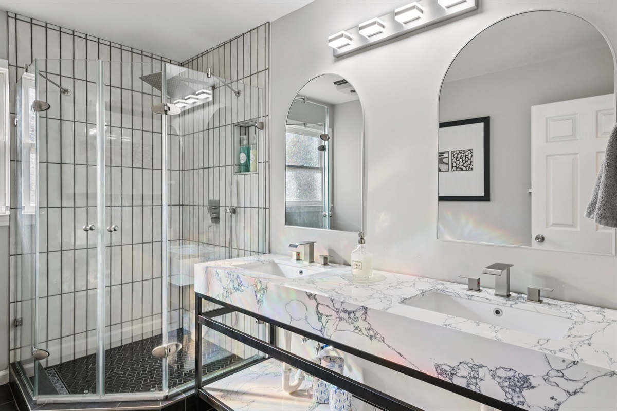 Bath5: The full bath has a double sink vanity and walk-in shower.