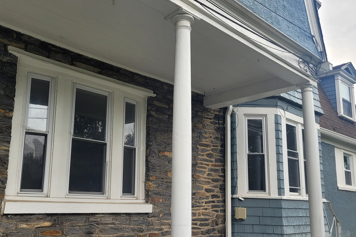 Relax on the wrap around porch as you wave to the neighbors