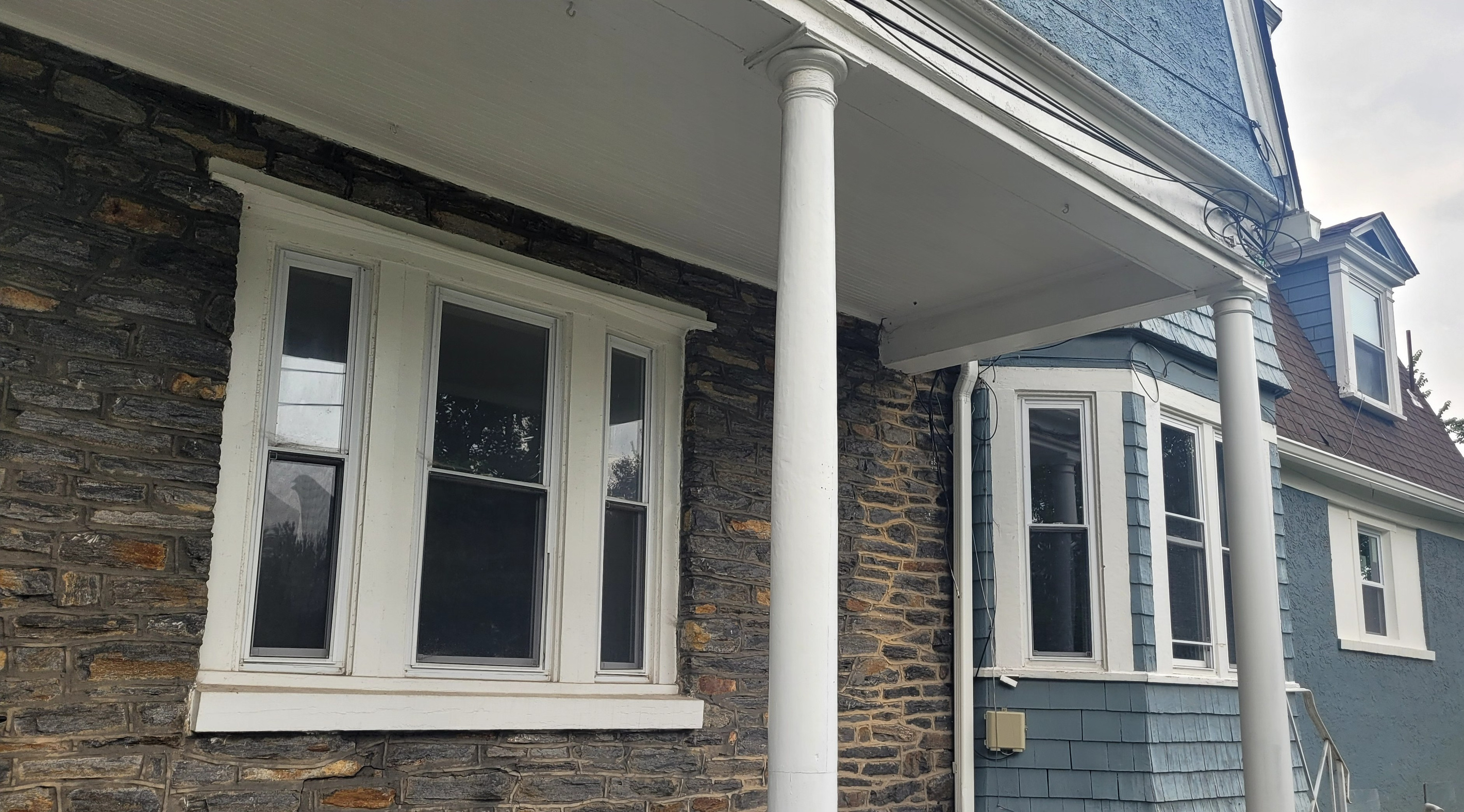 Relax on the wrap around porch as you wave to the neighbors