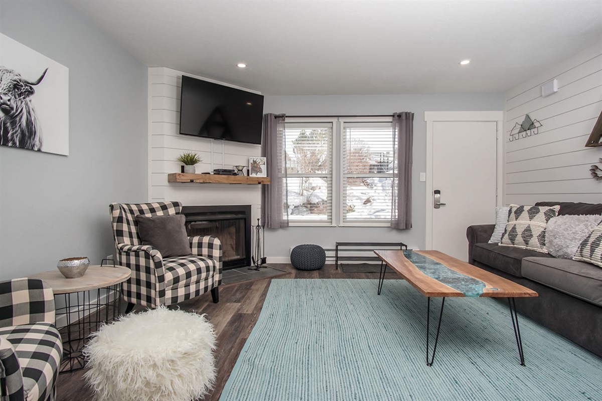 Spacious gathering area with sleeper sofa for more guests—the space is ideal for family movie nights or après-ski lounging.