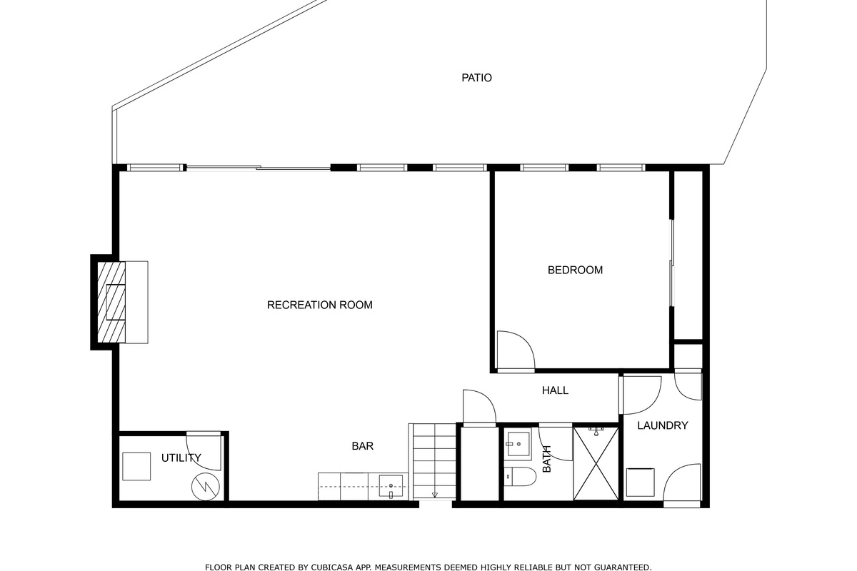 Lower level floor plan with recreation room, wet bar, bedroom, laundry and walk-out patio