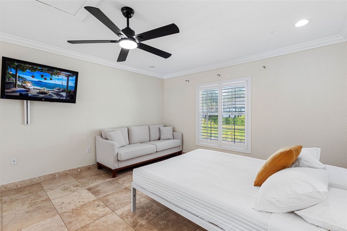 This bedroom is a generously sized and thoughtfully designed room that caters perfectly to families, groups of friends, or guests traveling together.