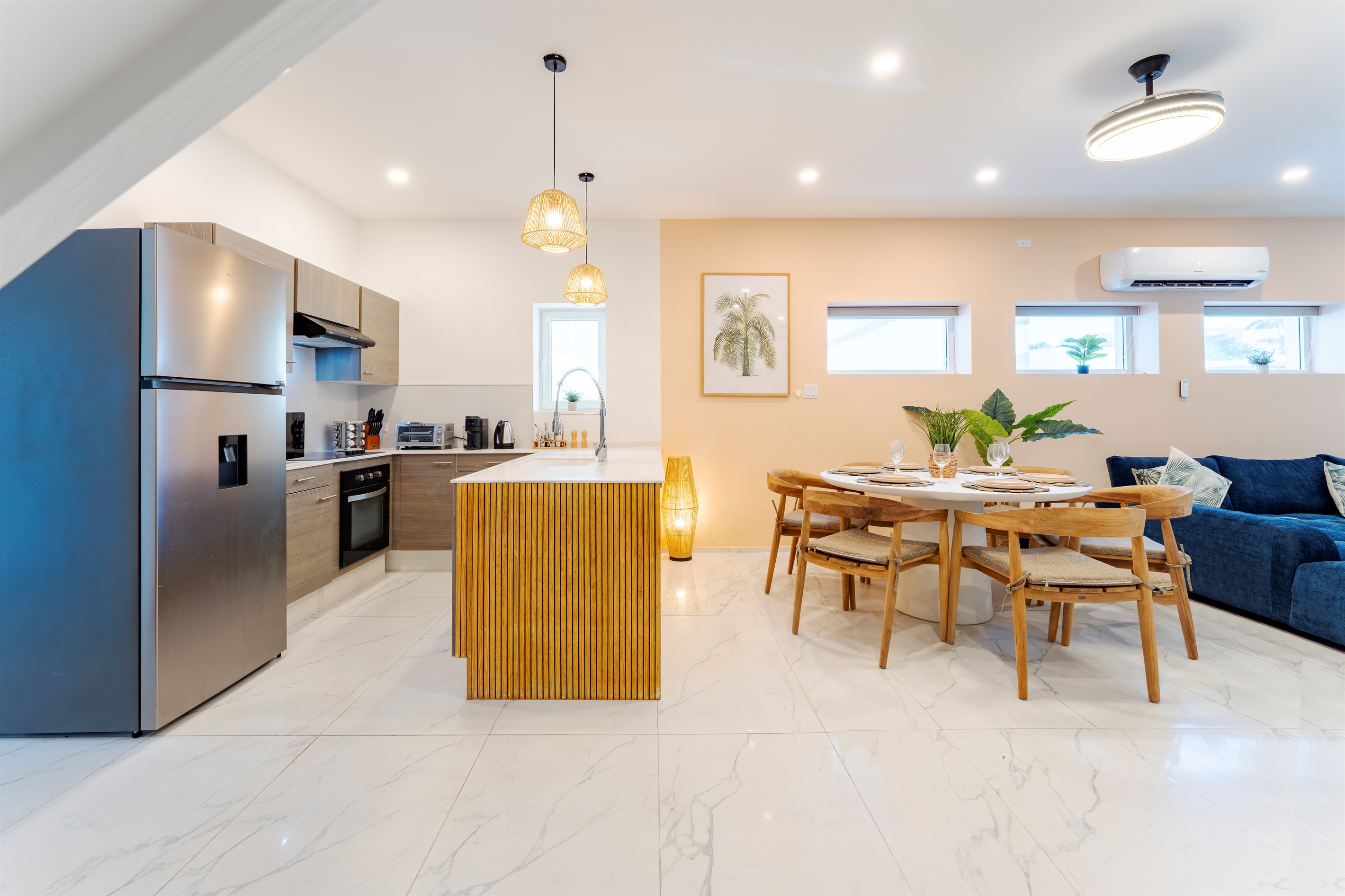 Spacious open-concept layout featuring a dining table for six and a large kitchen island