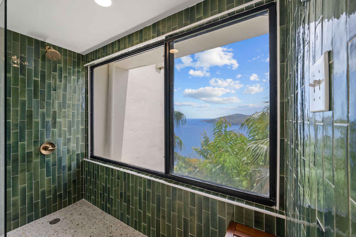 Gorgeous, remodeled shower looks out over the Caribbean ocean. Why go on vacation if you can't have views like this from every single room?