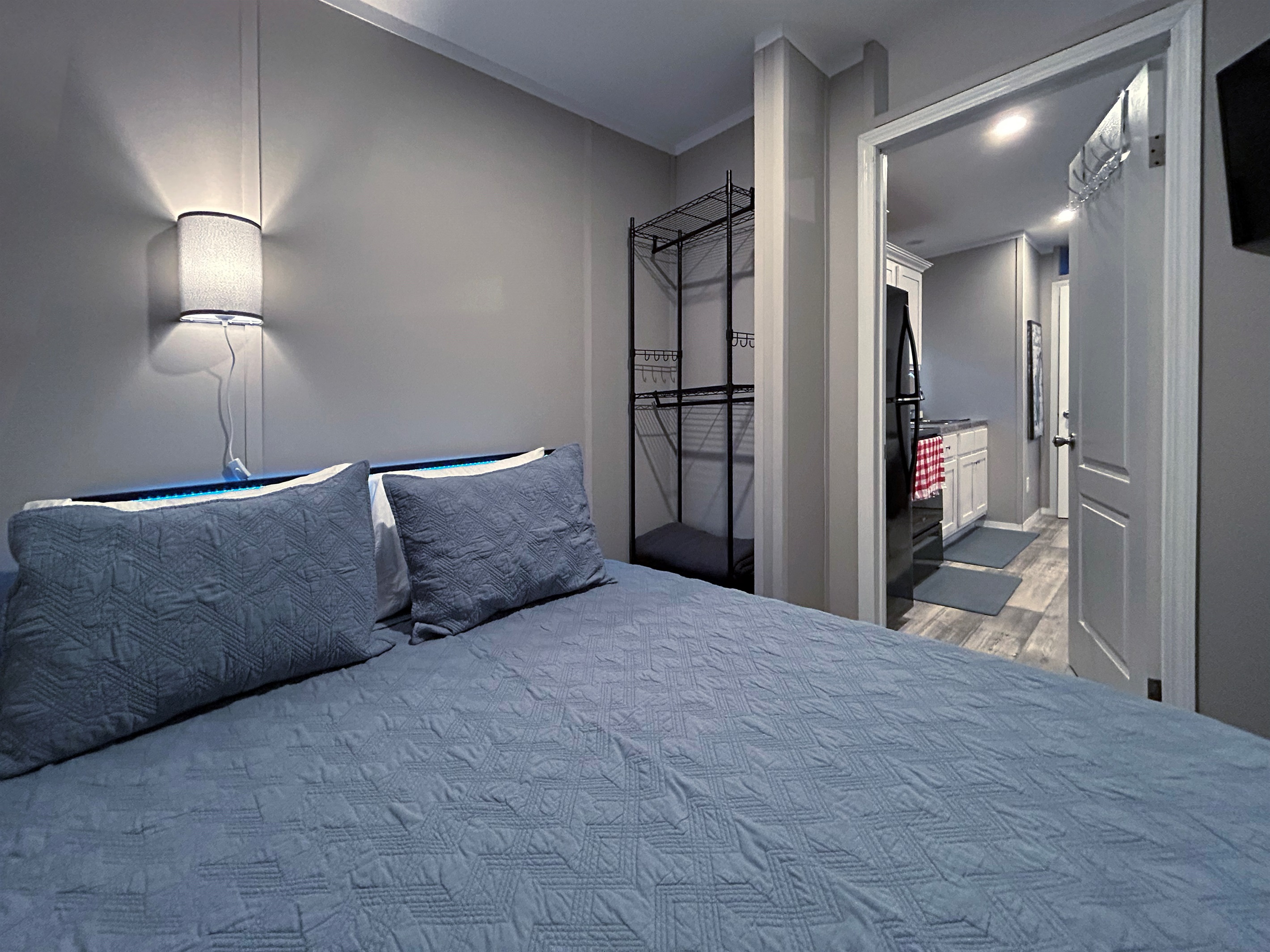 Bedroom #2 with queen bed, smart TV and en suite bathroom