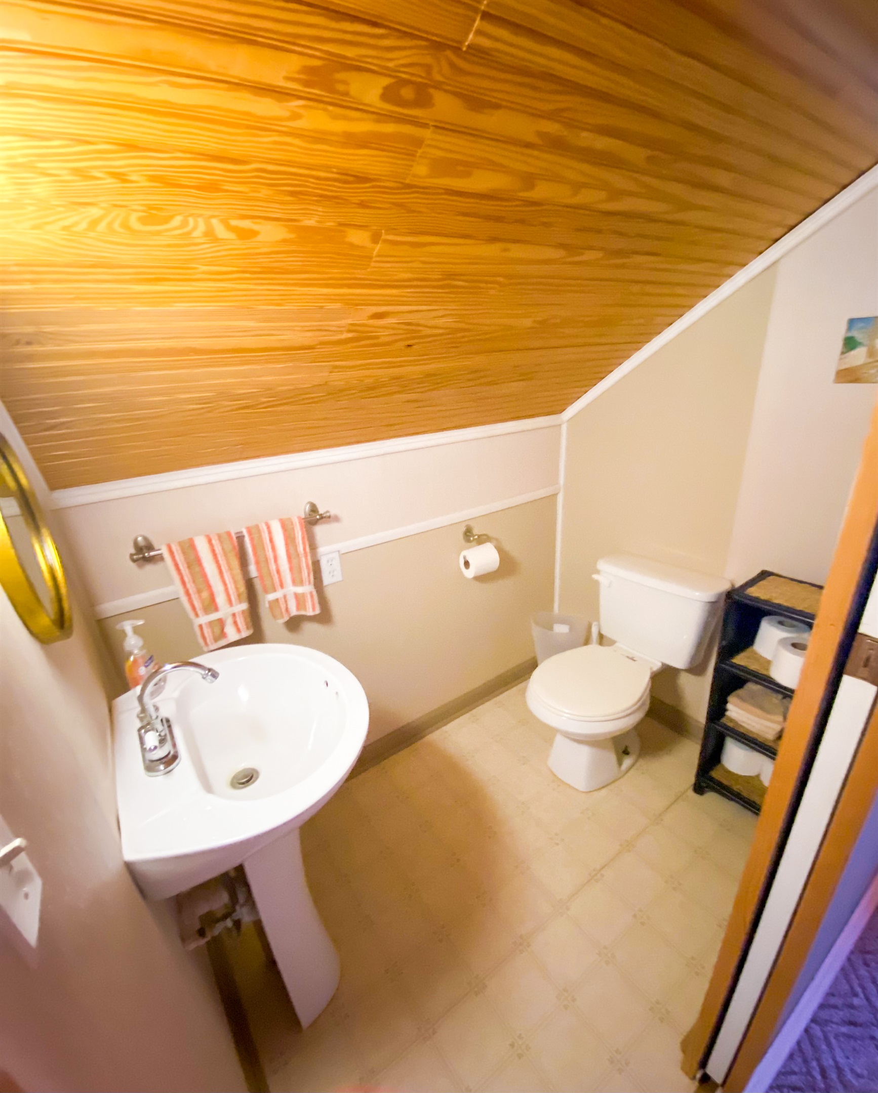 LHalf bath on 3rd floor in loft area.