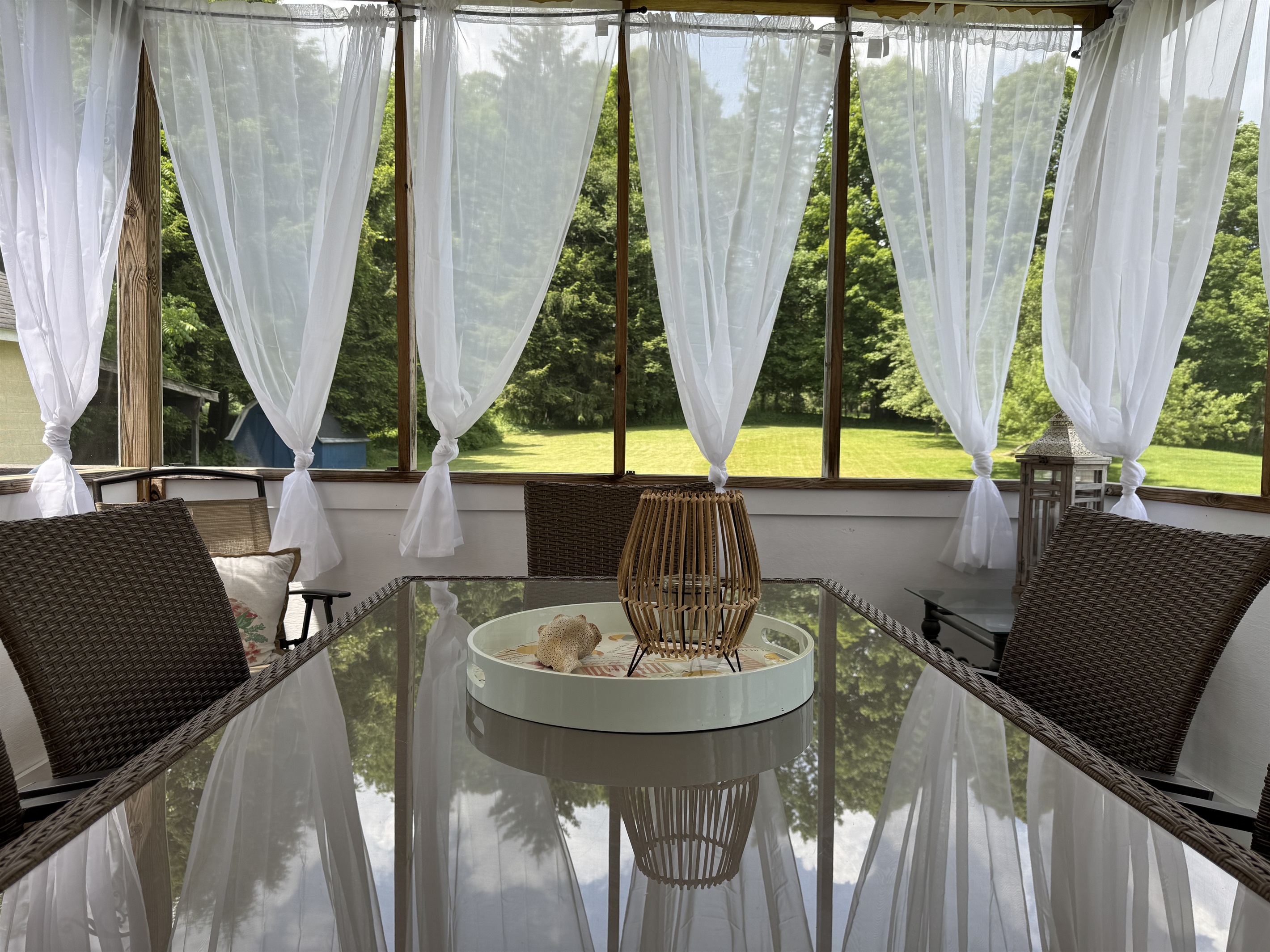 Enjoy a family meal on the beautiful and breezy feeling screened in porch