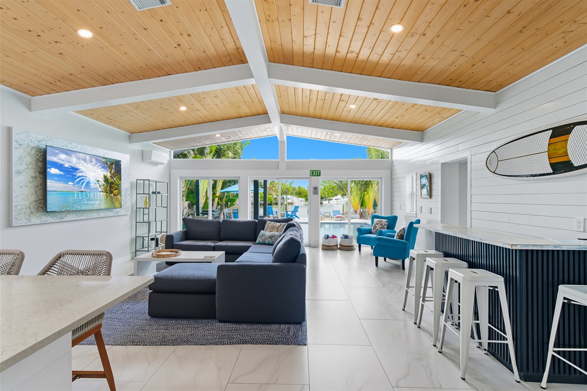 The open floor plan overlooks the pool and ocean.