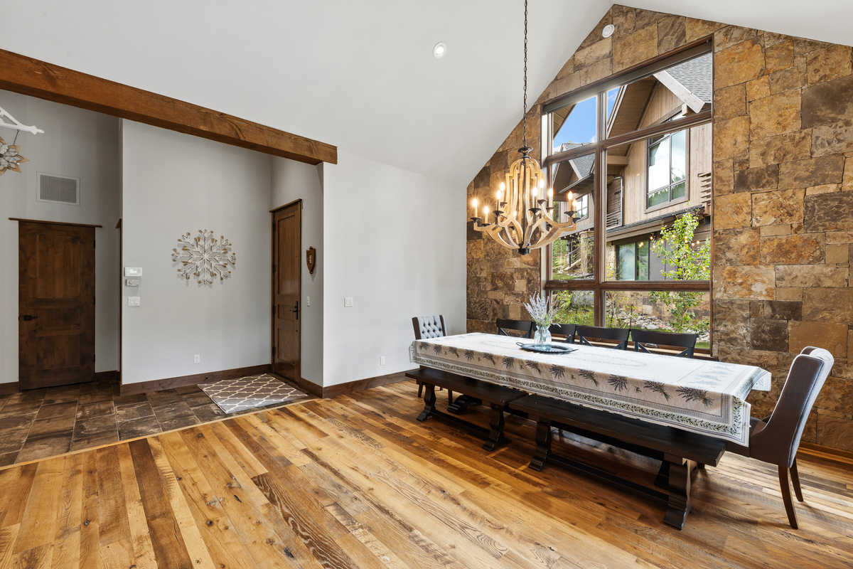 Dining area with seating for 10 and abundant natural light from large windows