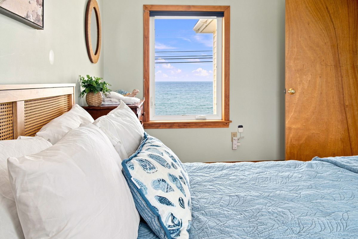 Wake up to beautiful ocean views from this inviting bedroom.