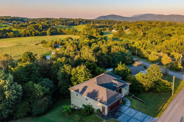 Aerial view of the home with mountain views and open countryside around it, Sevierville TN