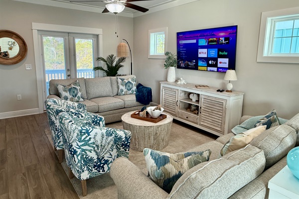 The whole family can enjoy the show together.  With two large, comfortable sofas and two additional barrel chairs, there is plenty of seating around the 75” Roku enabled Samsung TV. 