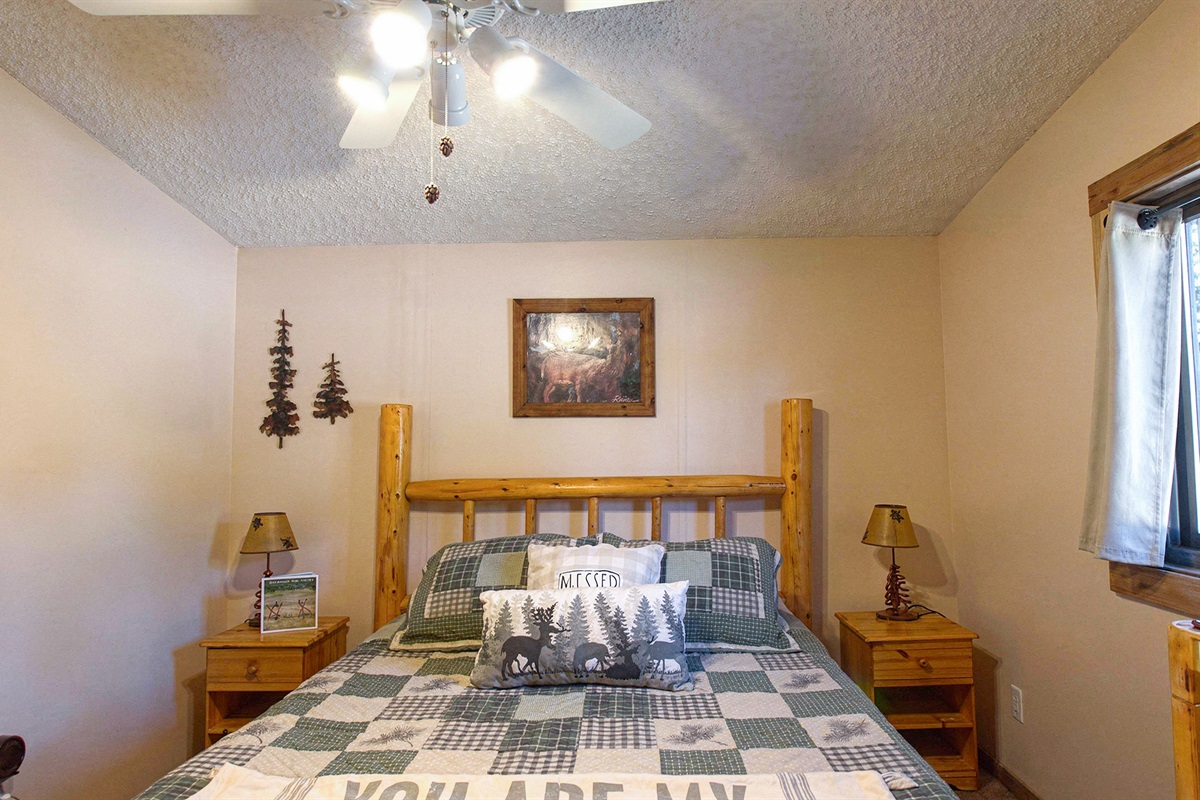 A serene bedroom escape in the heart of the pines.