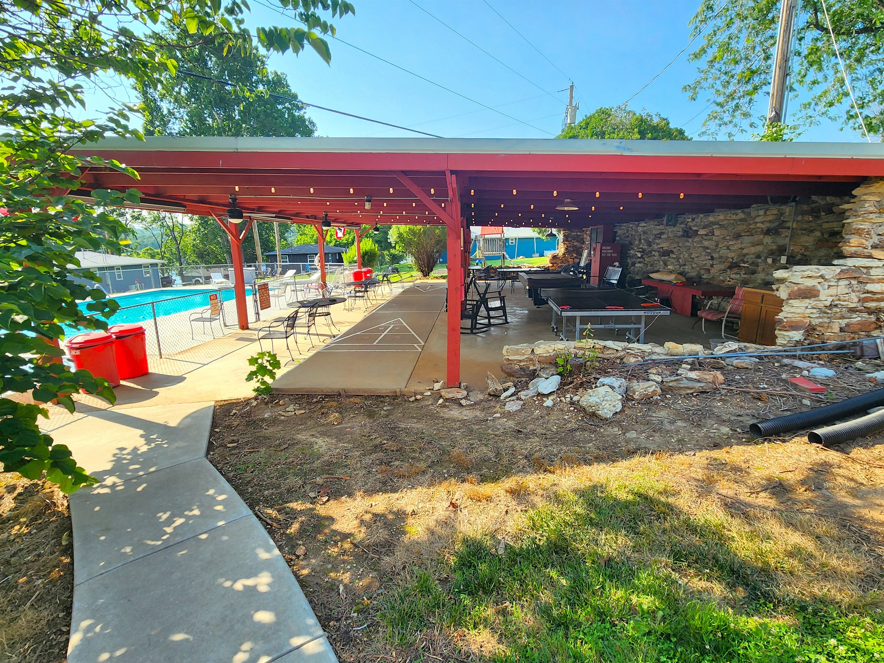 Second view of the pavilion shows it's placement beside the pool. Such a fun gathering area!