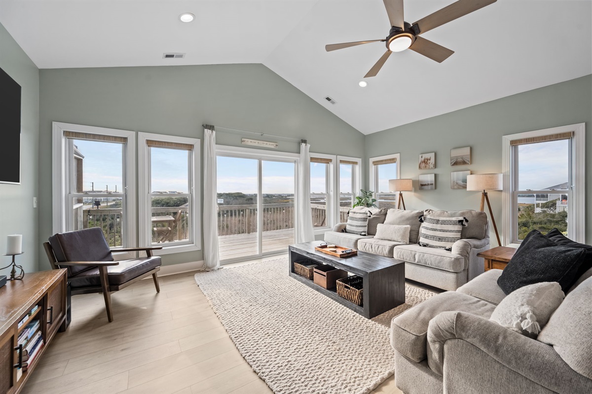 Bright and spacious living room with cozy seating and panoramic views