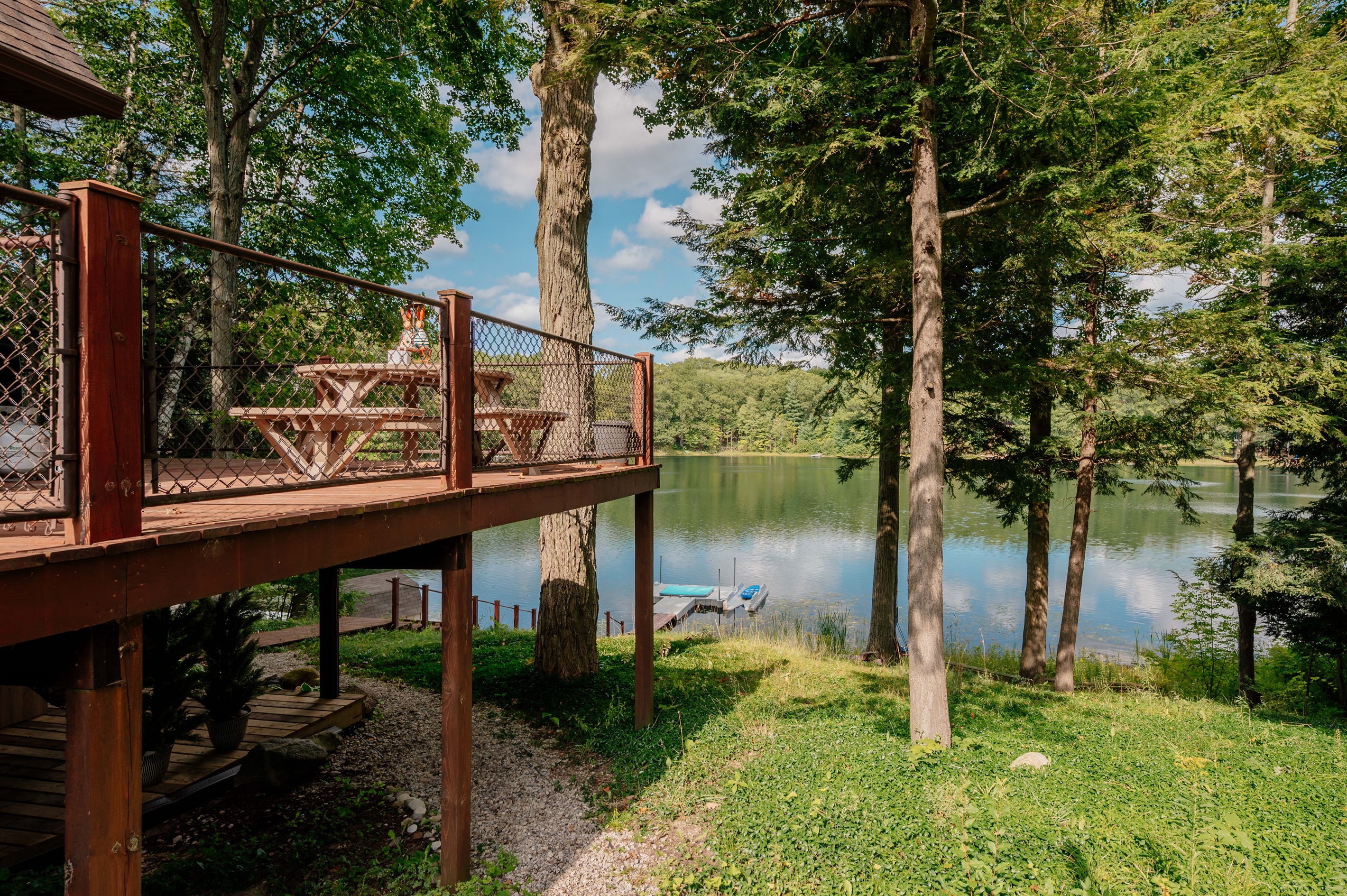Elevated deck with lake views through the trees