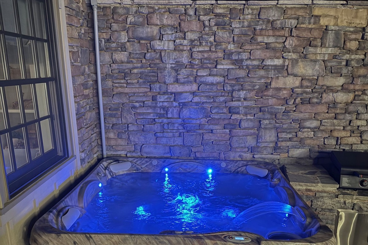 Relax in the hot tub at night, surrounded by soft lighting and peaceful lake views—the perfect way to unwind under the stars.