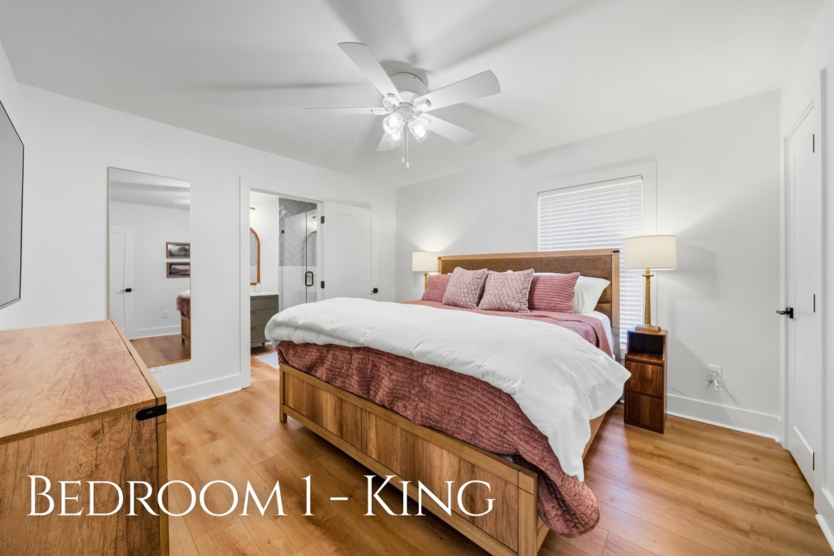 This spacious king bedroom features soft lighting, comfortable bedding, and a calm atmosphere perfect for restful nights after full days on the water.