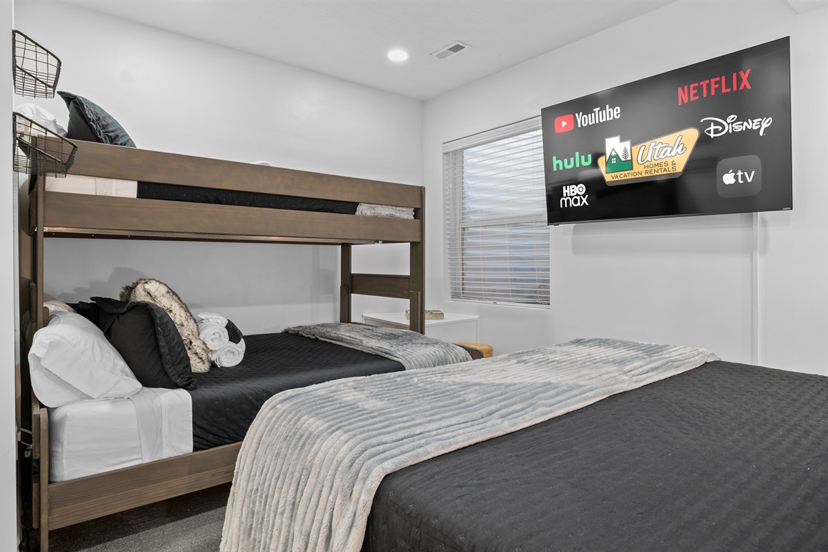 Downstairs bedroom with king bed and tasteful mountain décor.