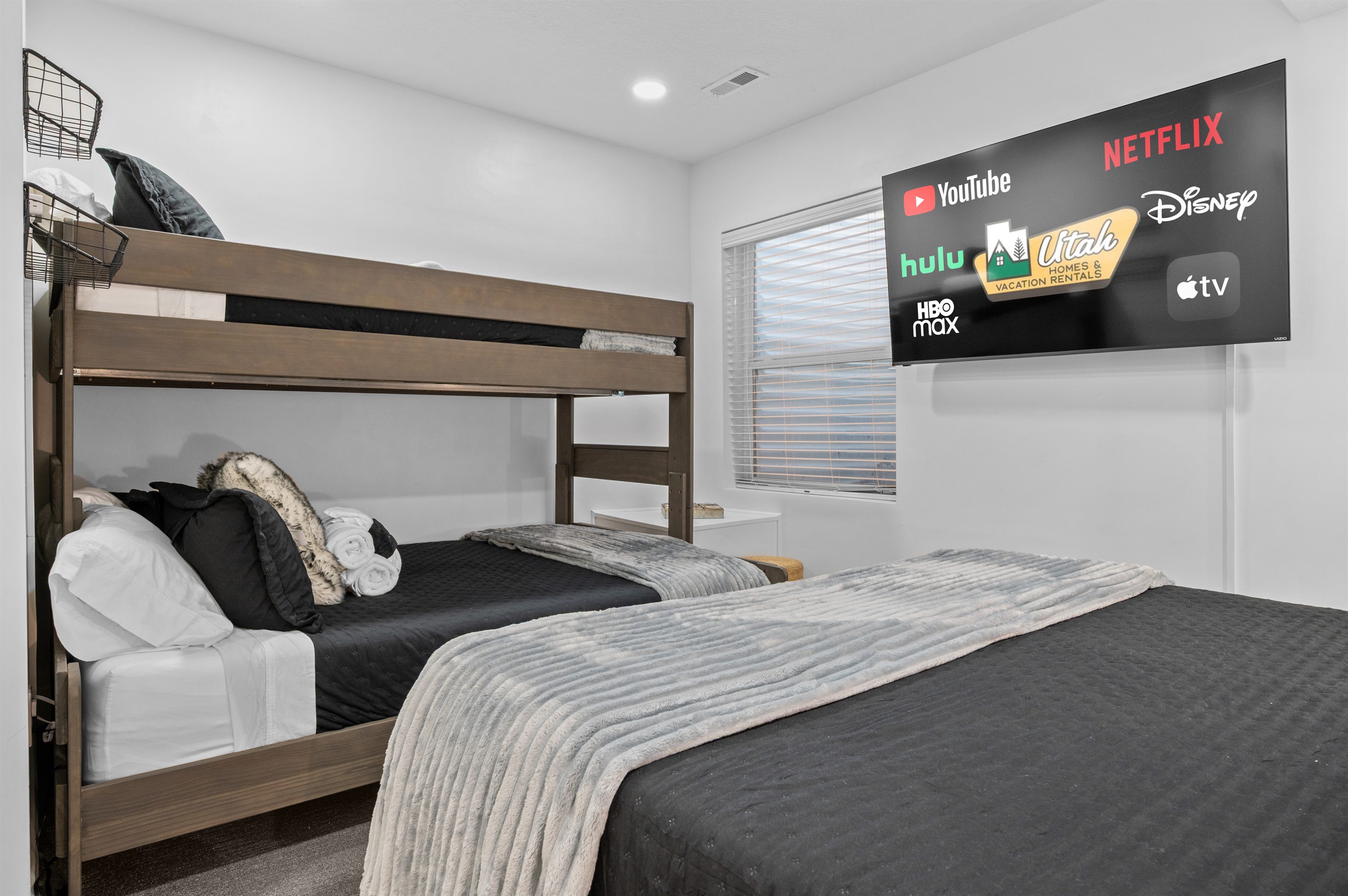 Downstairs bedroom with king bed and tasteful mountain décor.