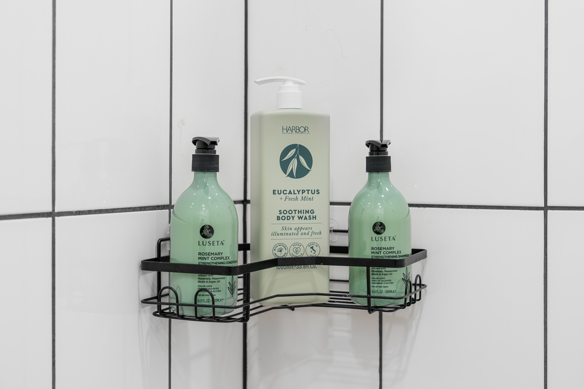 Rosemary mint and eucalyptus waiting in the shower, so there is no need to pack the big bottles. Little touches like these let you arrive light, wash off the road, and start your stay feeling completely looked after.