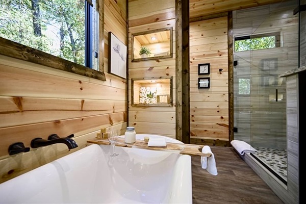 Luxury redefined—relax in a bubble bath surrounded by warm light and tranquil views.