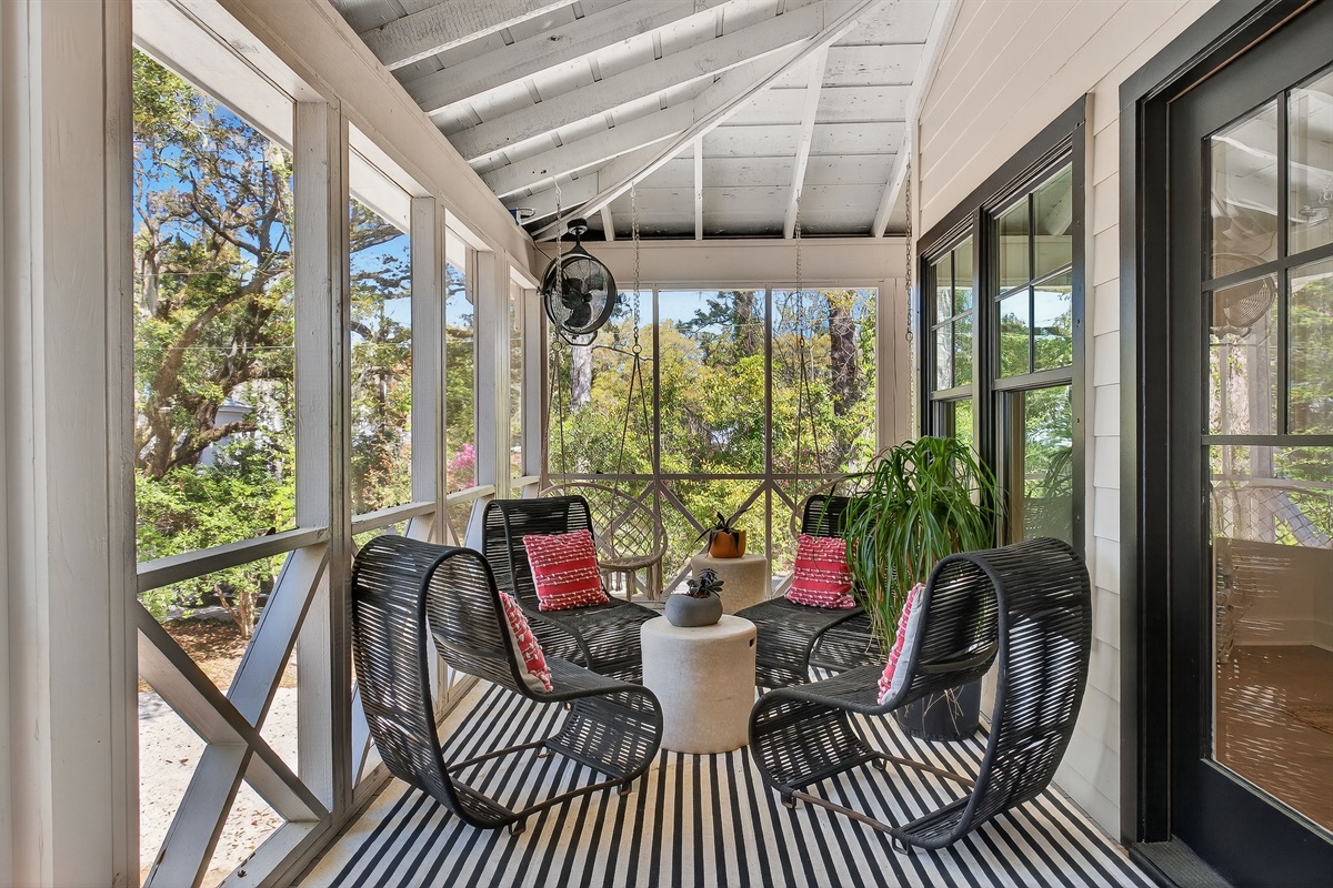 Relaxed front entry screened porch—perfect for morning coffee or evening wine