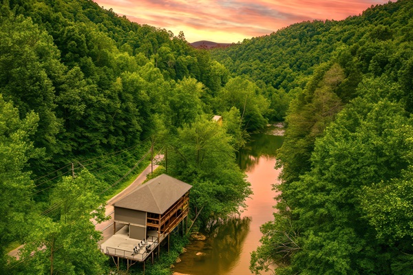 Welcome to Take Me to the River Cabin perched above the famous Little Pigeon River. Enjoy the serenity of nature on the 2 level of decks facing the river that you can enjoy in addition to private river access along the river's edge just below the cabin.