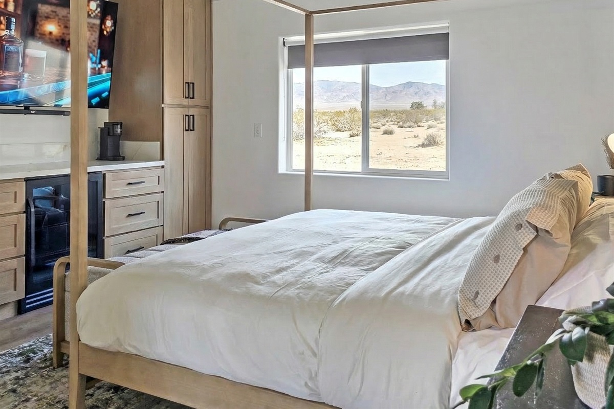 Private entrance from patio with king bed and beverage fridge, coffee maker and 75" smart tv with surround sound.