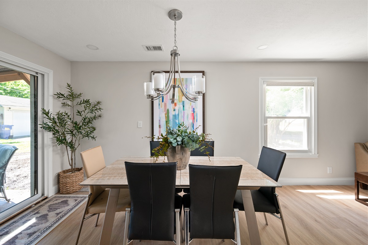 Enjoy plenty of natural light pouring into the dining area from the large window and the backyard sliding glass door.