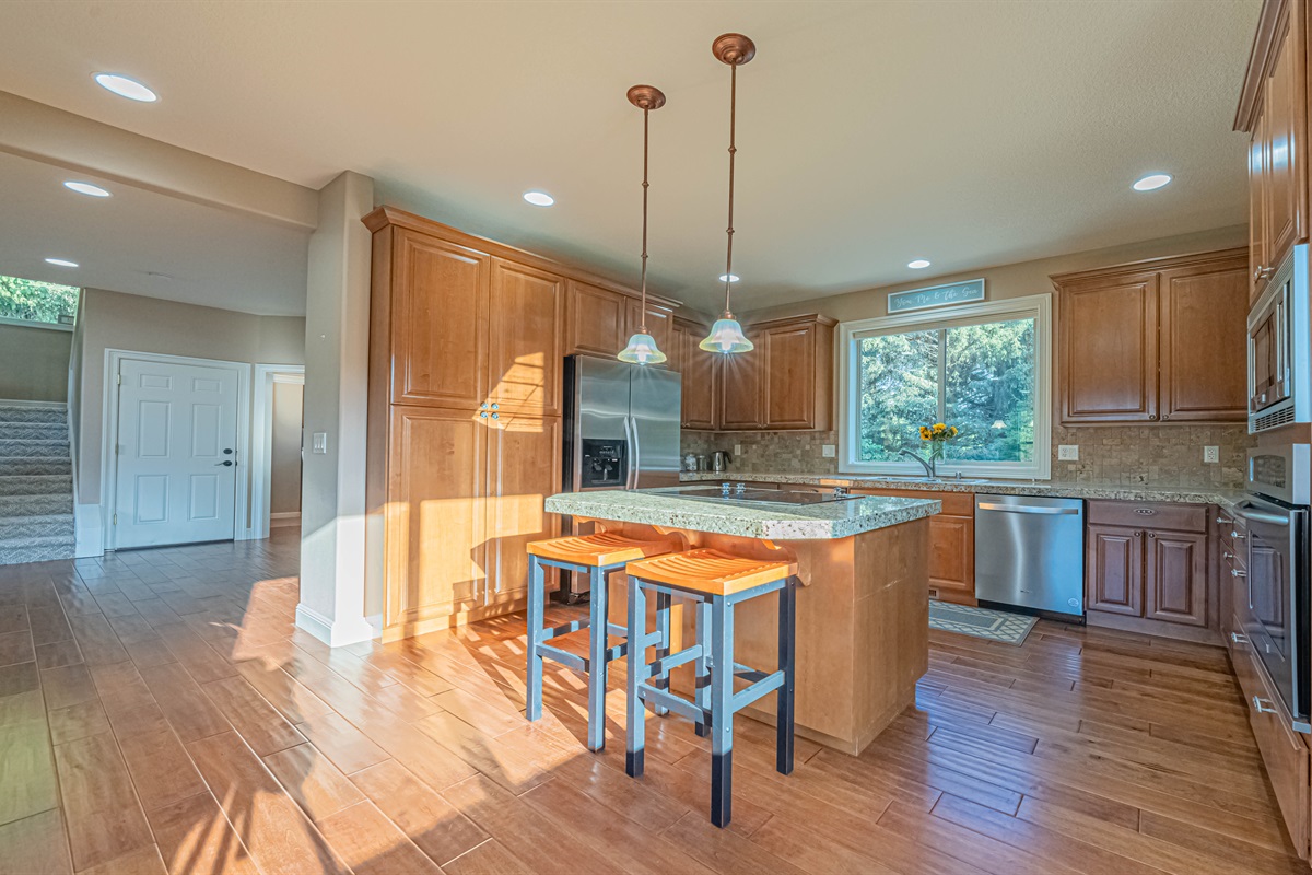 Modern kitchen with stainless steel appliance.