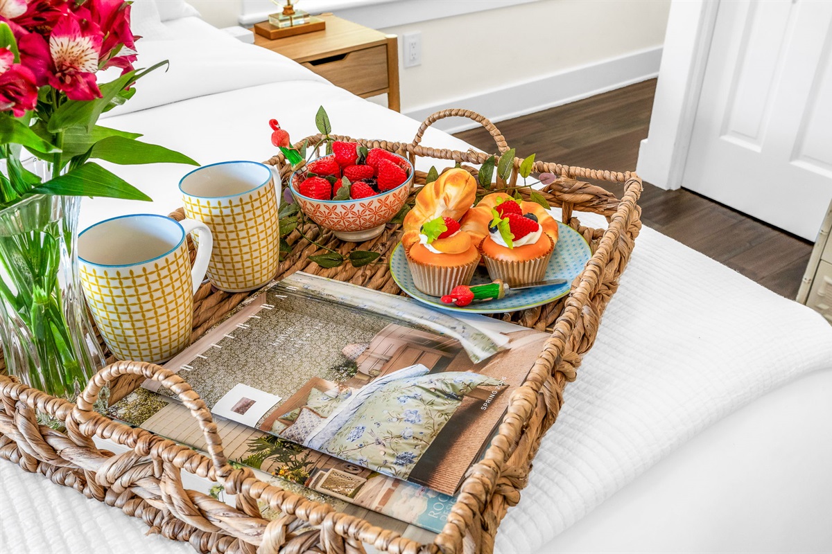 Serene king primary suite featuring a smart TV, private en-suite bathroom, and elegant French doors that open directly to the pool—perfect for seamless indoor-outdoor living and relaxing mornings or evenings.