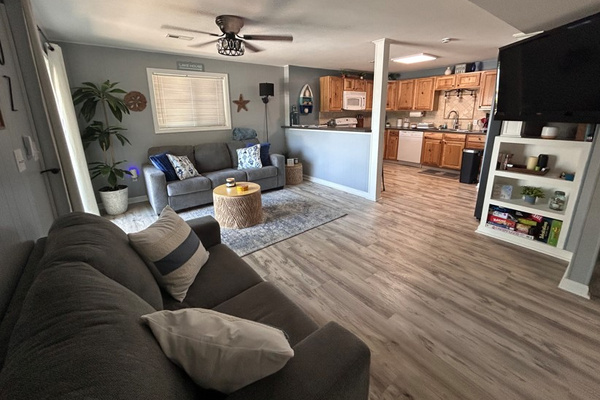 Open concept living room and kitchen with 2 walk-out options.
