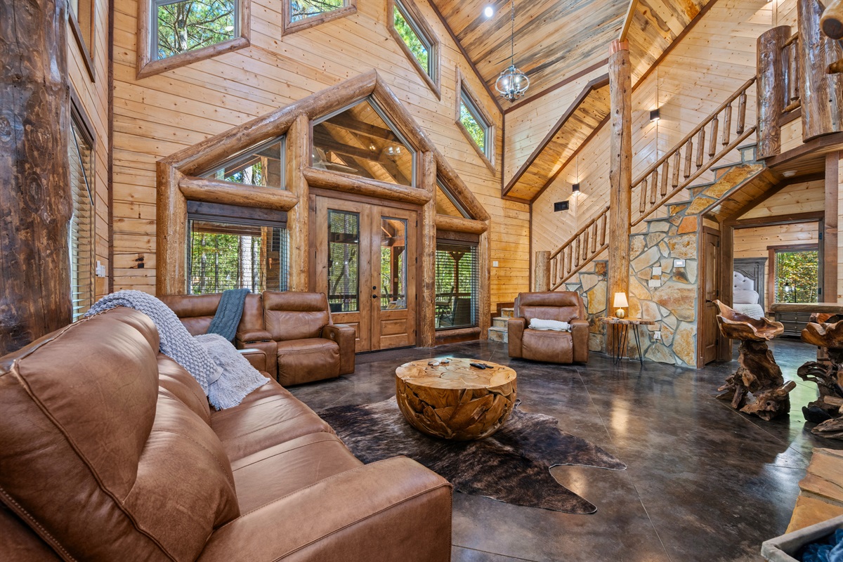 Relaxed seating around the stone fireplace in the great room.