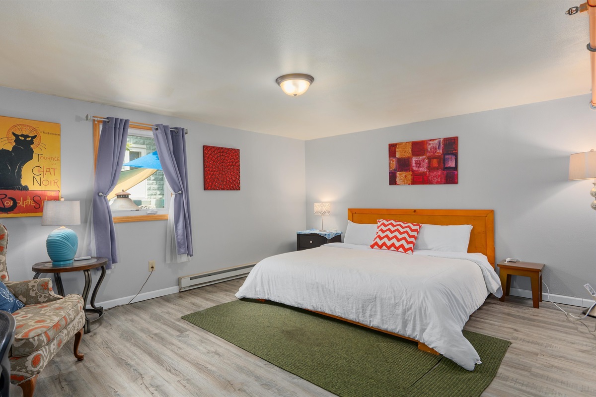 Eclipse's lower bedroom offers a great king bed, small writing area and nice AC off the patio area.