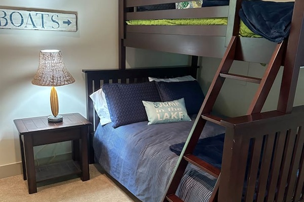 Full-over-twin bunk with ample storage, connected to the Jack and Jill bathroom.