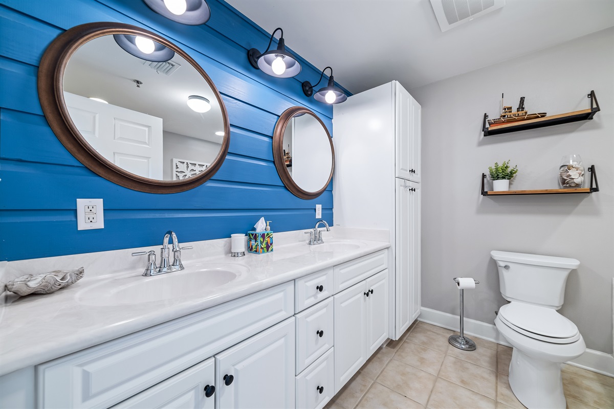 A well-appointed bathroom featuring convenient double sinks, offering ample space and functionality for daily routines.