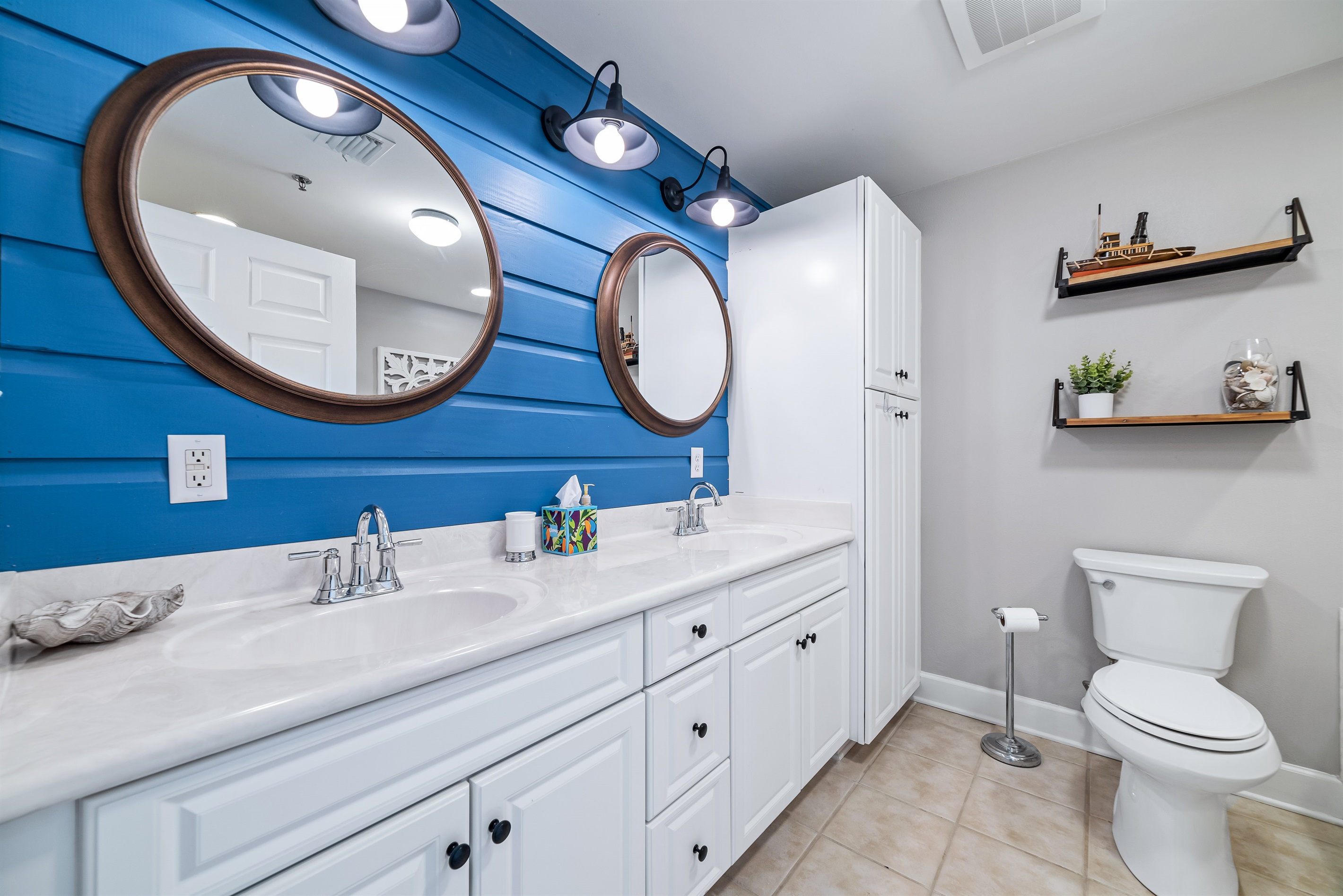 A well-appointed bathroom featuring convenient double sinks, offering ample space and functionality for daily routines.