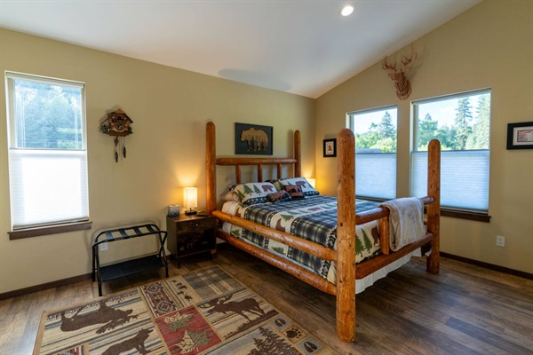 Guest bedroom. Queen bed. TV.  Views to the north out to the barn and horse pasture.