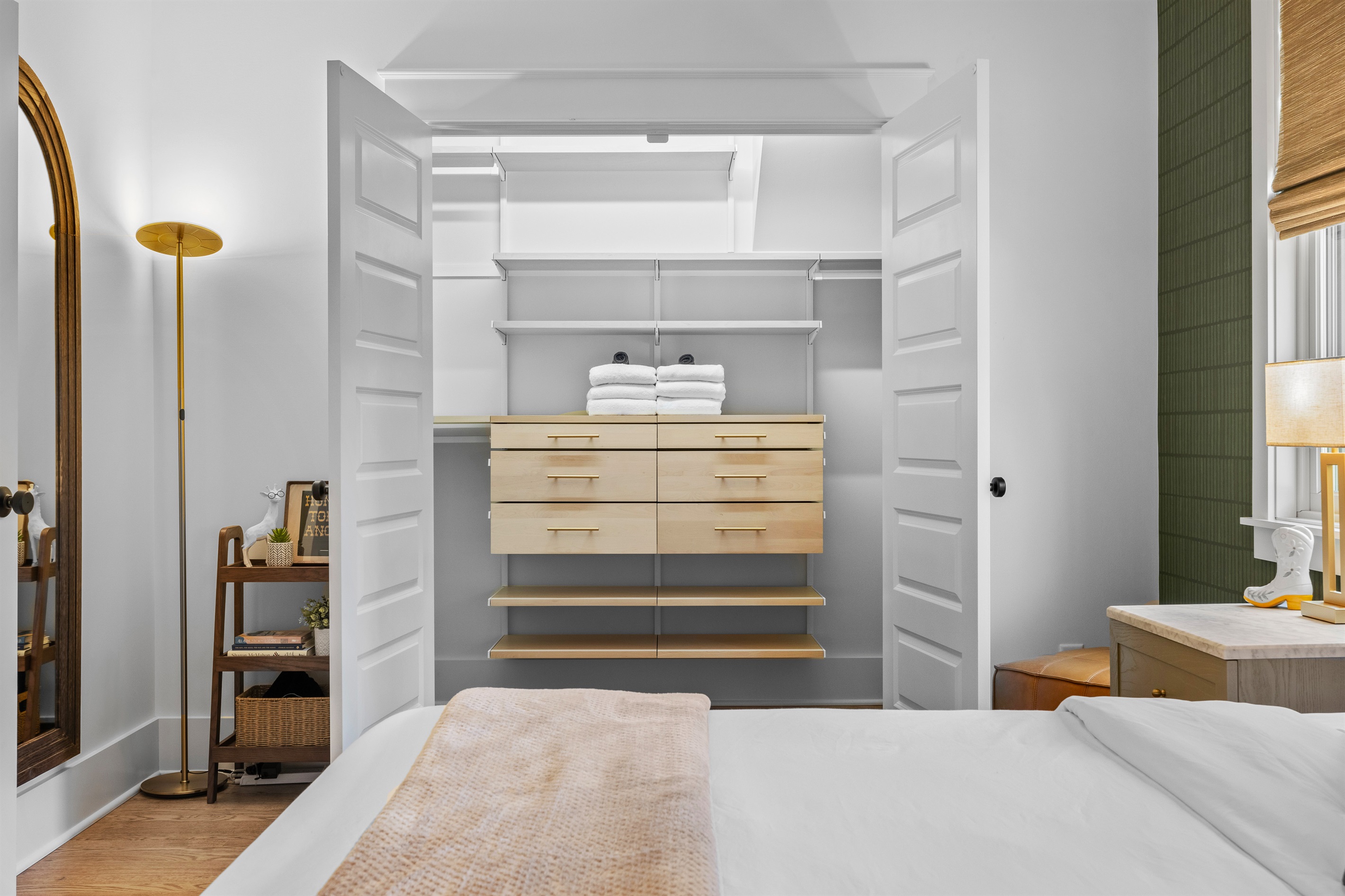 Walk-in closet with built-in drawers and plenty of storage.